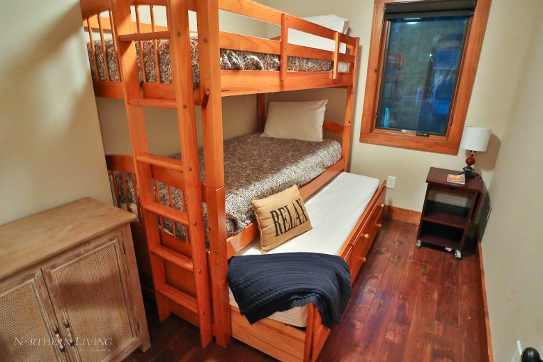 Second-level twin bunk bedroom with twin trundle.