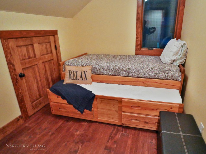 Second-level twin bedroom with twin trundle.