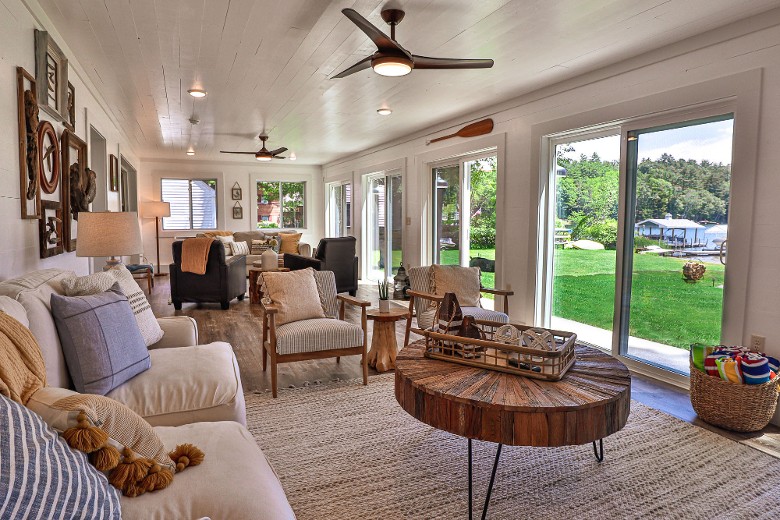 The lake-level three-season room. Enjoy all the lake views through the five sliding glass doors and the fireplace.