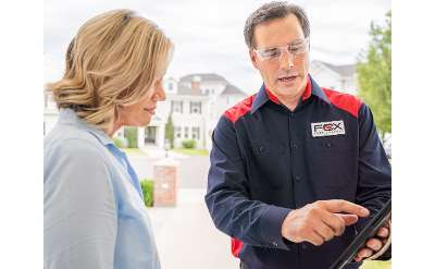 technician pointing at report