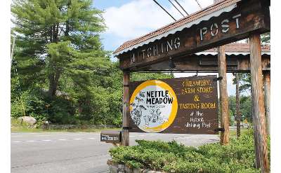 sign for the hitching post and nettle meadow