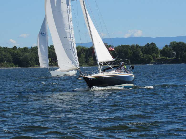 sailboat cruising across the water
