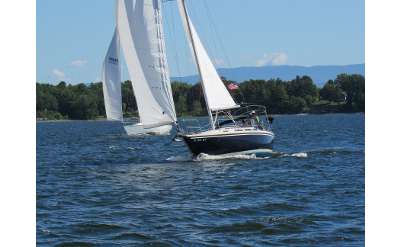 sailboat cruising across the water