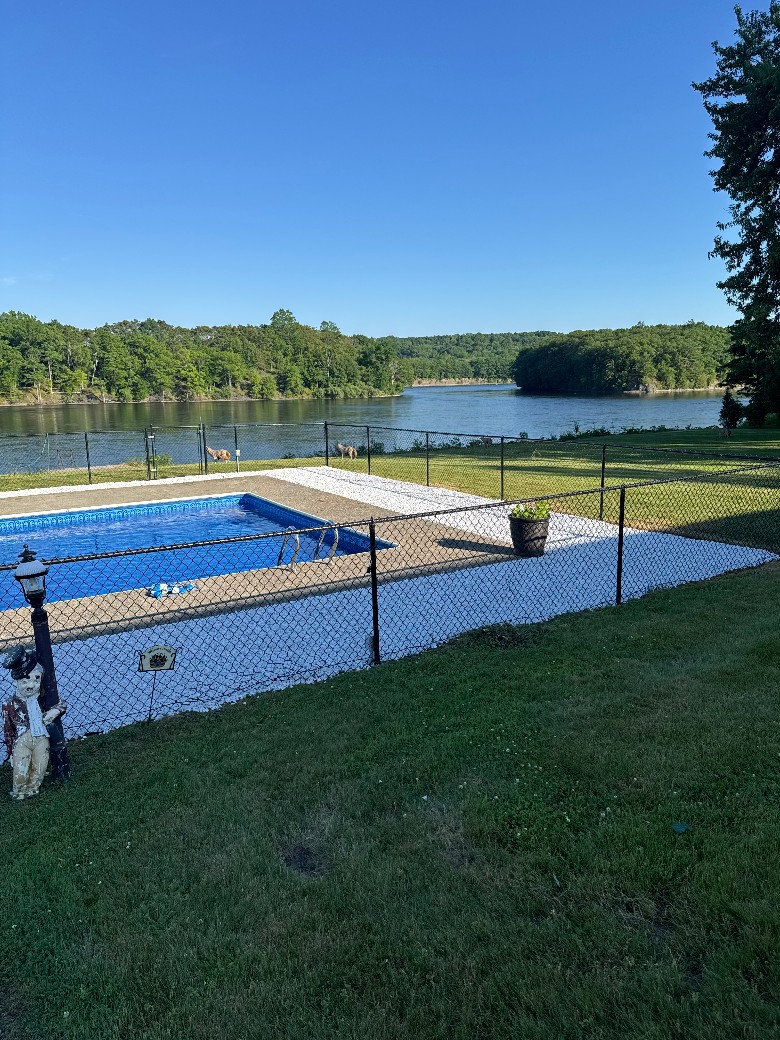 Newly placed landscaping and rocks around updated in ground heated pool area