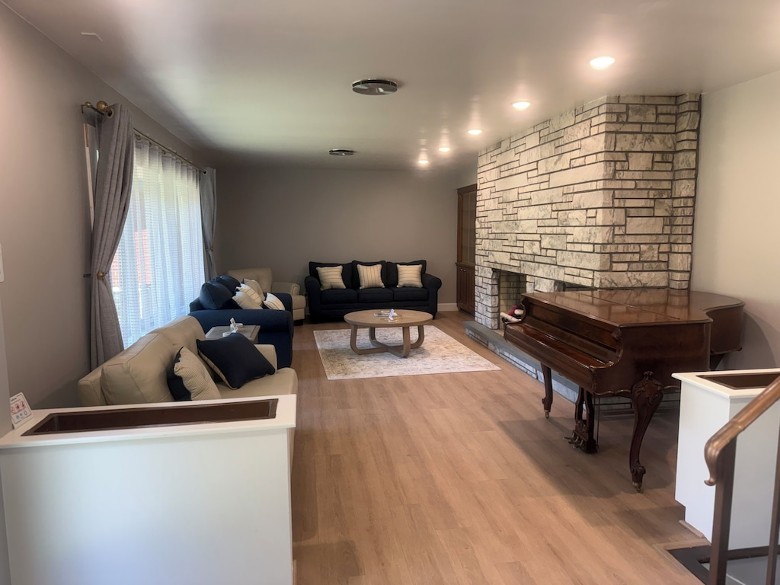Formal living room with new furniture including queen pull out sofa bed