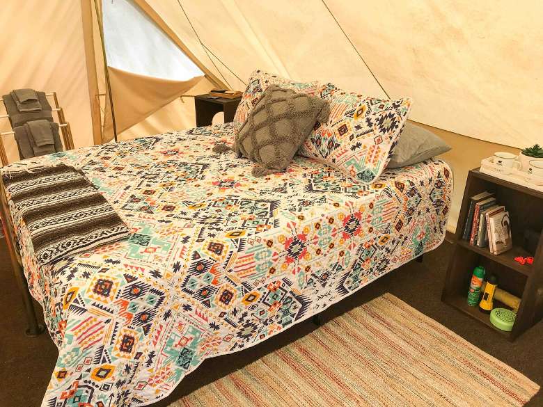bed inside a glamping tent