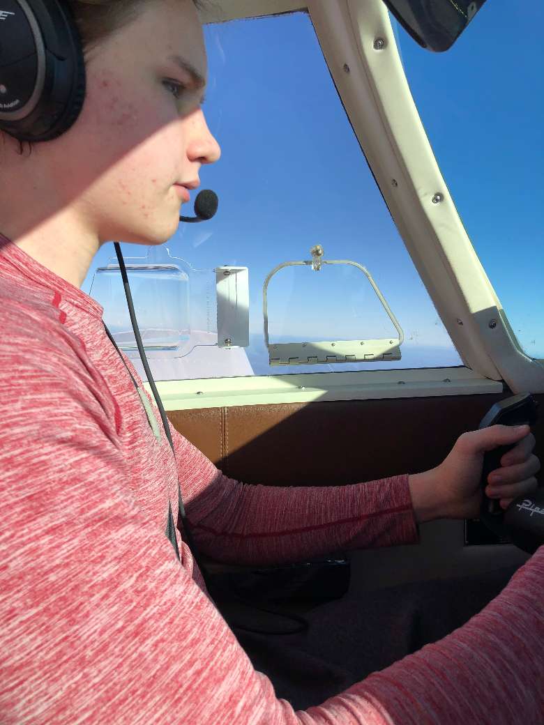 teenager flies a plane