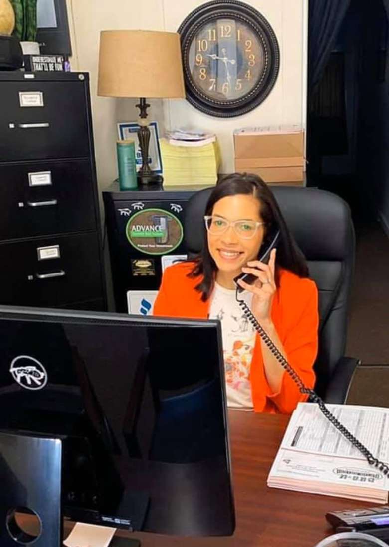 smiling receptionist on phone