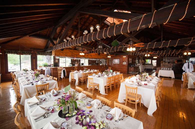 wedding reception tables inside a rustic restaurant