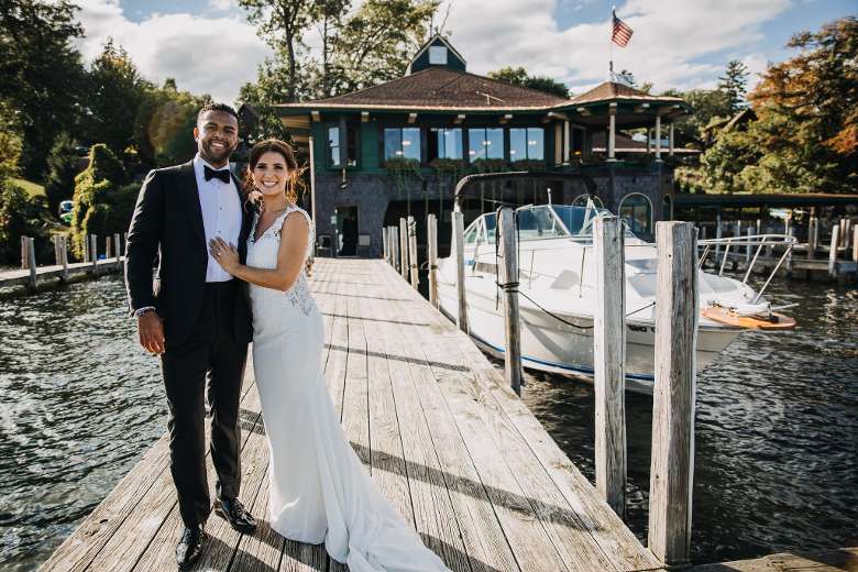 bride and groom on a boat dock during the day