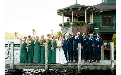 bride, groom, and bridal party on boat dock