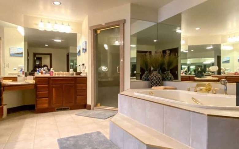 master bathroom with a large tub