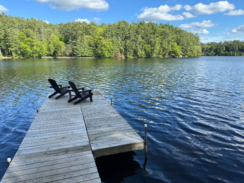 Dock with two Adirondack chairs