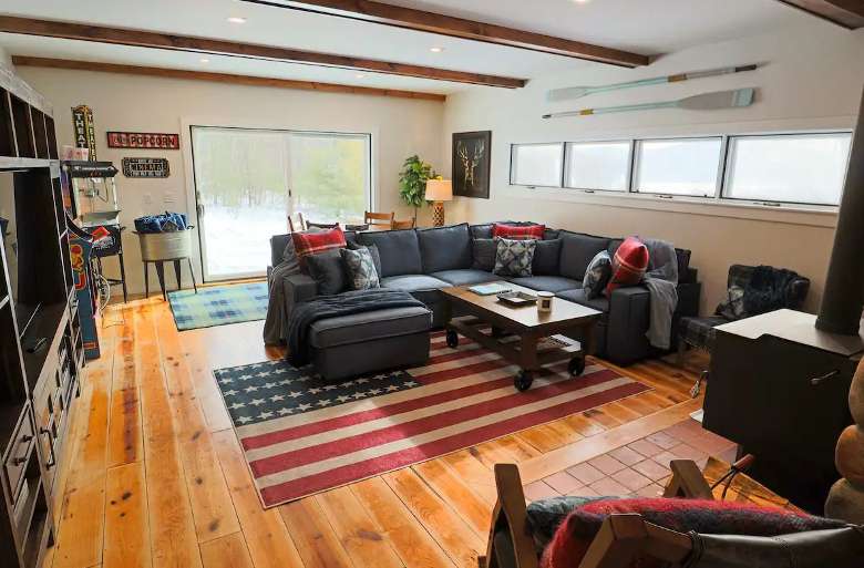 large family room with couch and games
