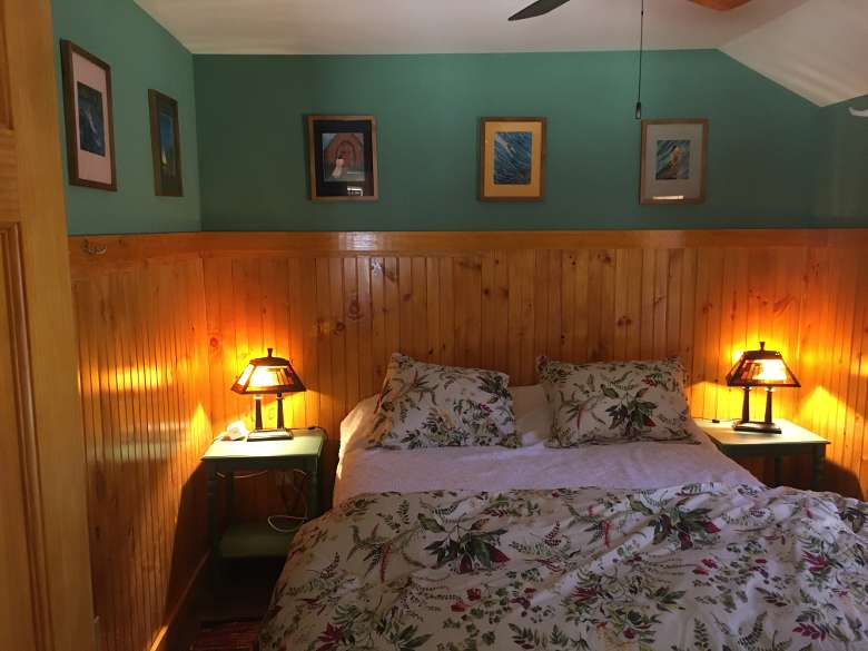 bed with two lamps by the sides