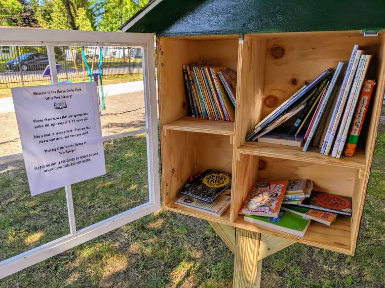 little book library with sign