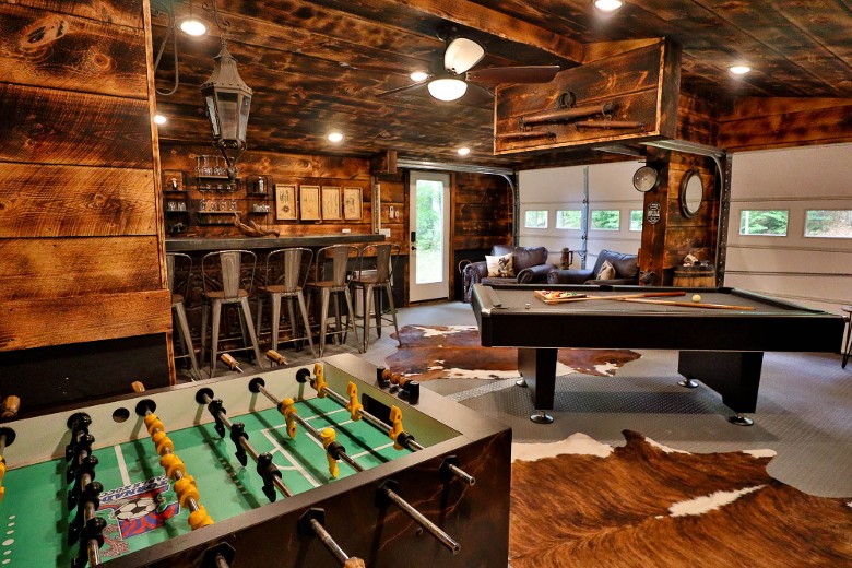 Lakeside Retreat large game room with pool table, foosball table, arcade games, bar and more!