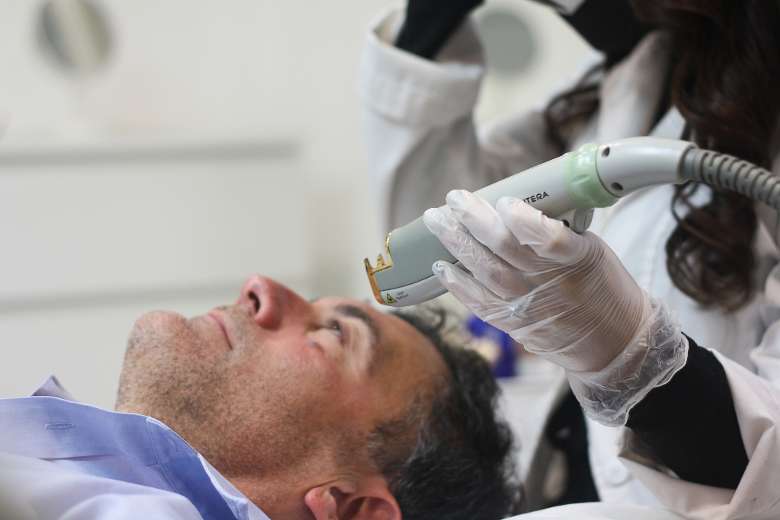 man receiving a laser skin treatment