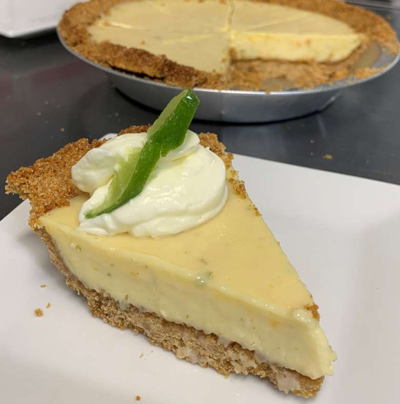 a plate with a slice of key lime pie