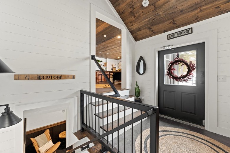 Entrance to the Loft. Stairs to the common area and stairs leading to the game room and laundry area.