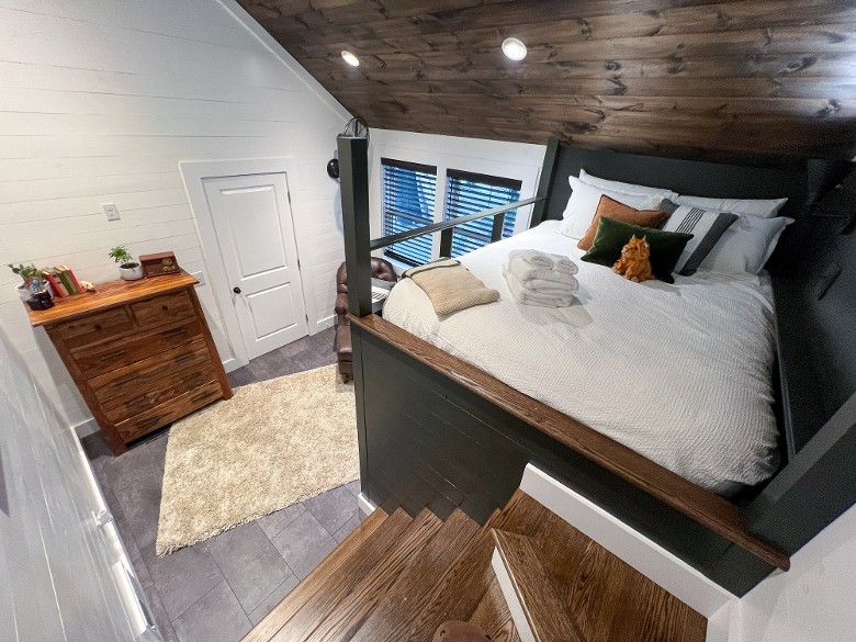 Queen Bunk Beds with a dresser for clothing storage.