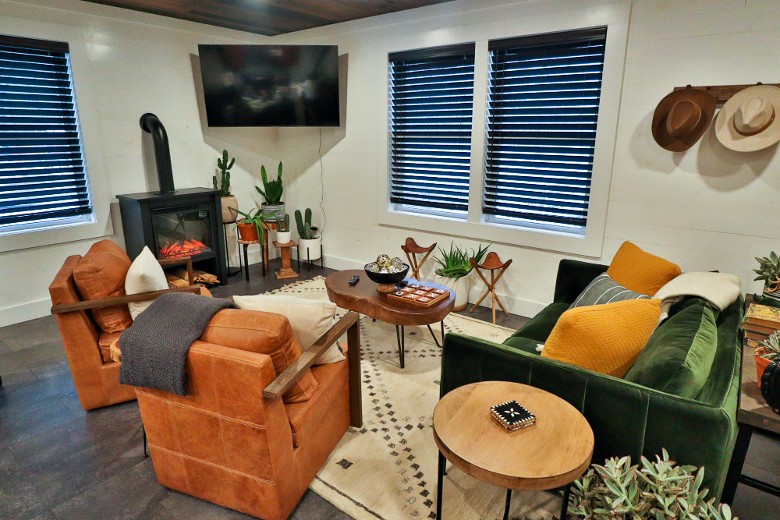 Living Room sitting area with an electric Fireplace and TV.