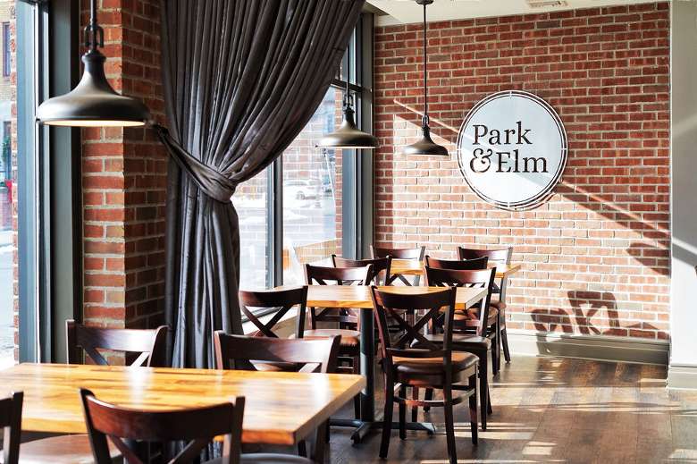 seating in a restaurant with park & elm sign