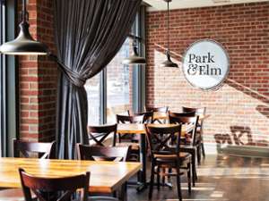 seating in a restaurant with park & elm sign