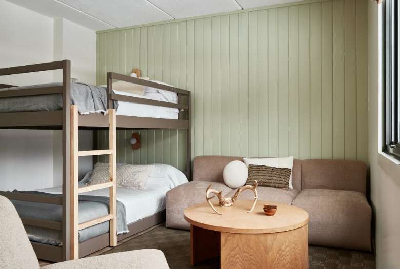 hotel room with a bunk bed and sitting area