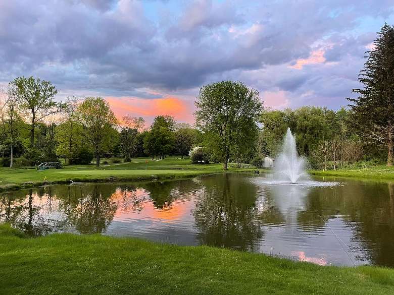 golf course pond with a fountain