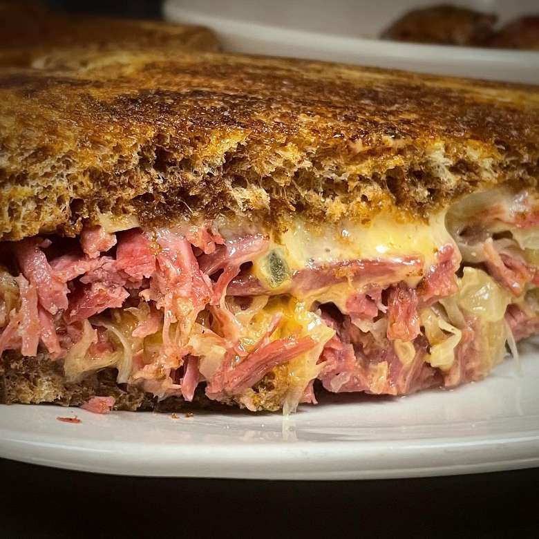 toasted sandwich with meat and cheese