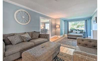 a large living room with furniture and rugs