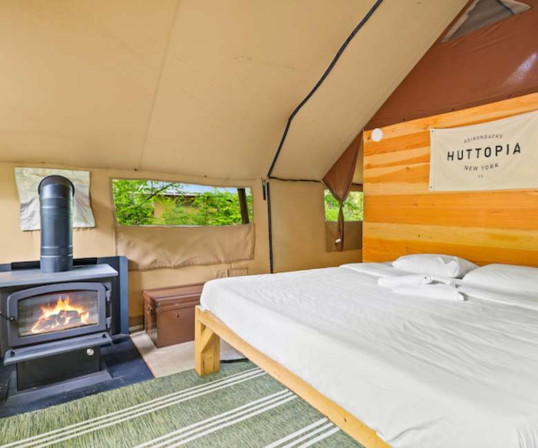 Tent with a bed and stove