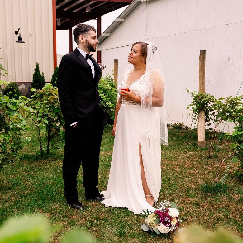 bride and groom outside winery