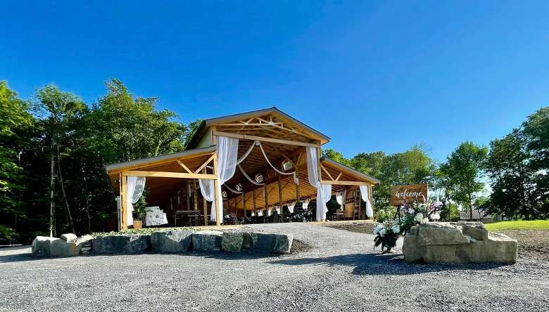 wedding venue of an open faced barn with patios