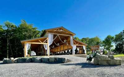 wedding venue of an open faced barn with patios