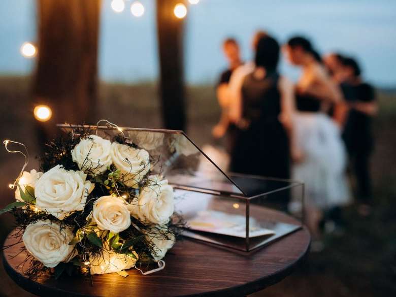 bridal flower bouquet by a glass box