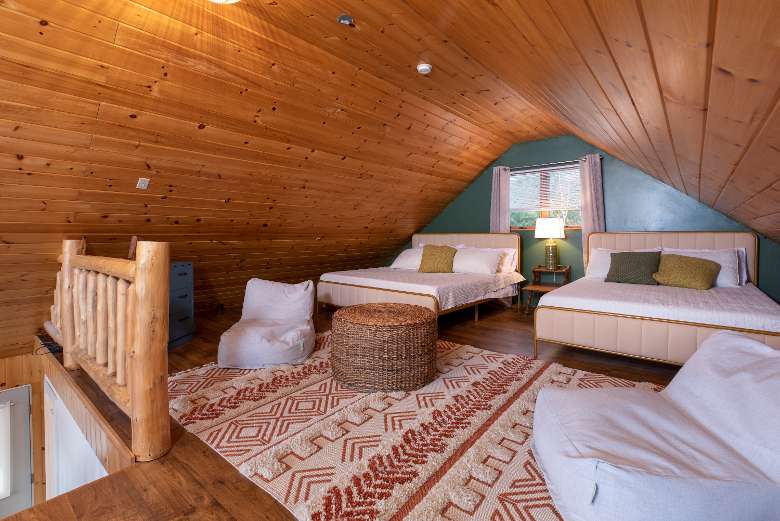 house loft area with two beds