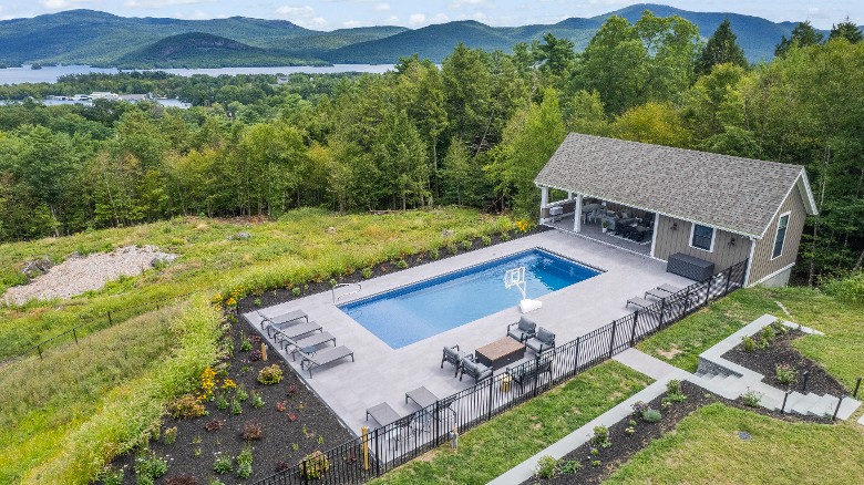 Overview of the pool area and pool house.