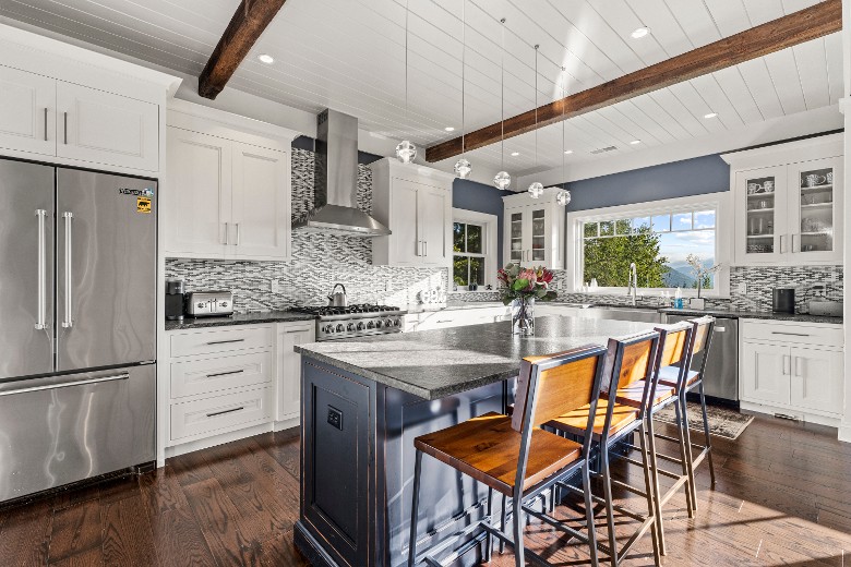 This home features an open-concept gourmet kitchen with top-of-the-line appliances