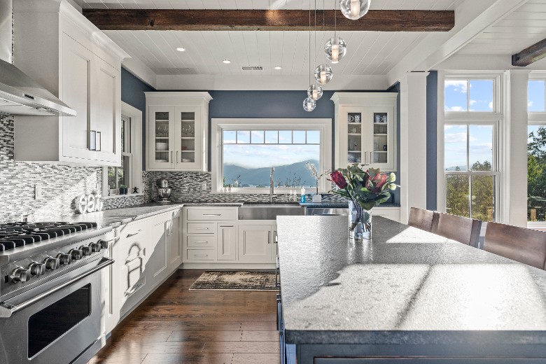 This home features an open-concept gourmet kitchen with top-of-the-line appliances