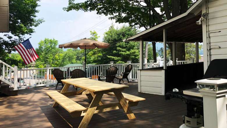 deck space with a picnic table and chairs