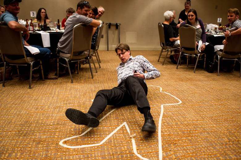 man on floor with outline of body