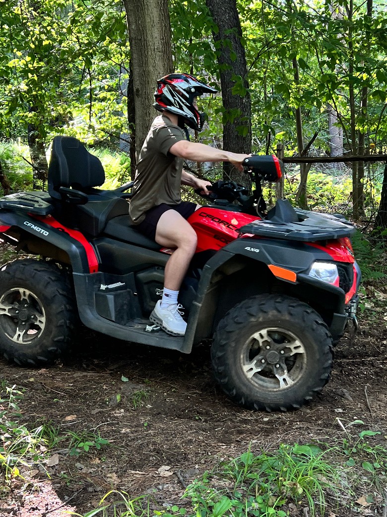 Experience the ride of an ATV through the woods