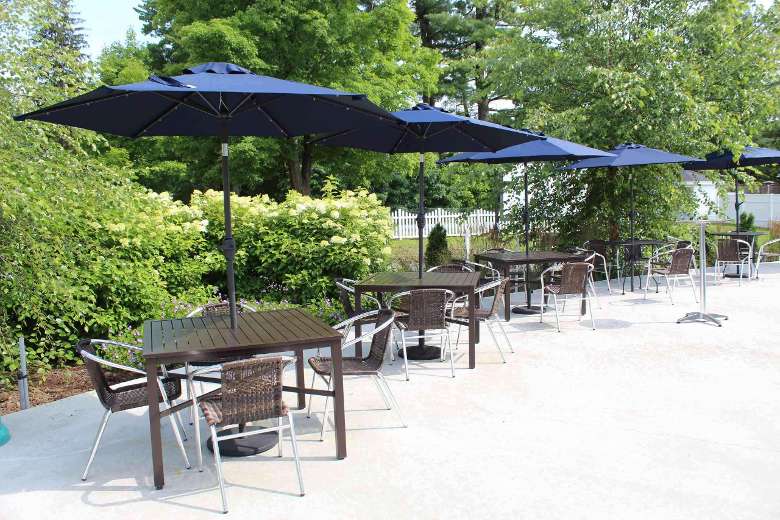 tables and blue umbrellas on a patio