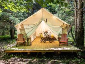 exterior of a glamping tent on a wooden platform