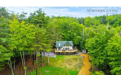 shot of the front of a house in the mountains