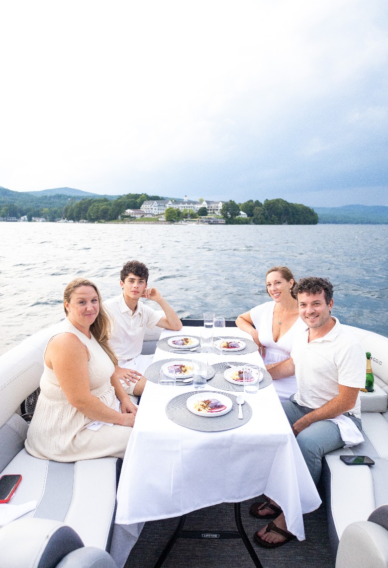 people with food on a boat table