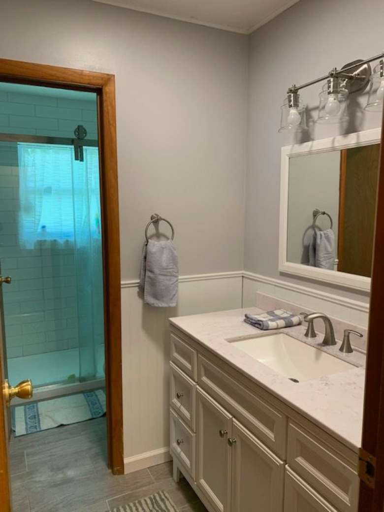 bathroom with sink and mirror on the right