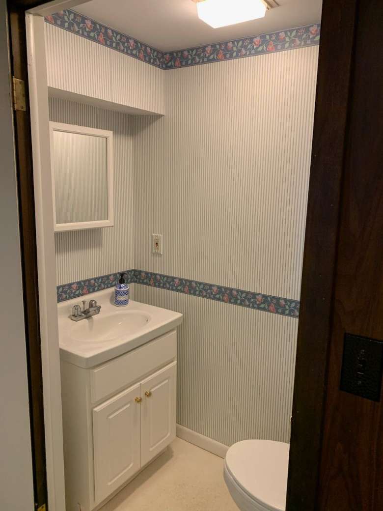 a small bathroom with sink and toilet